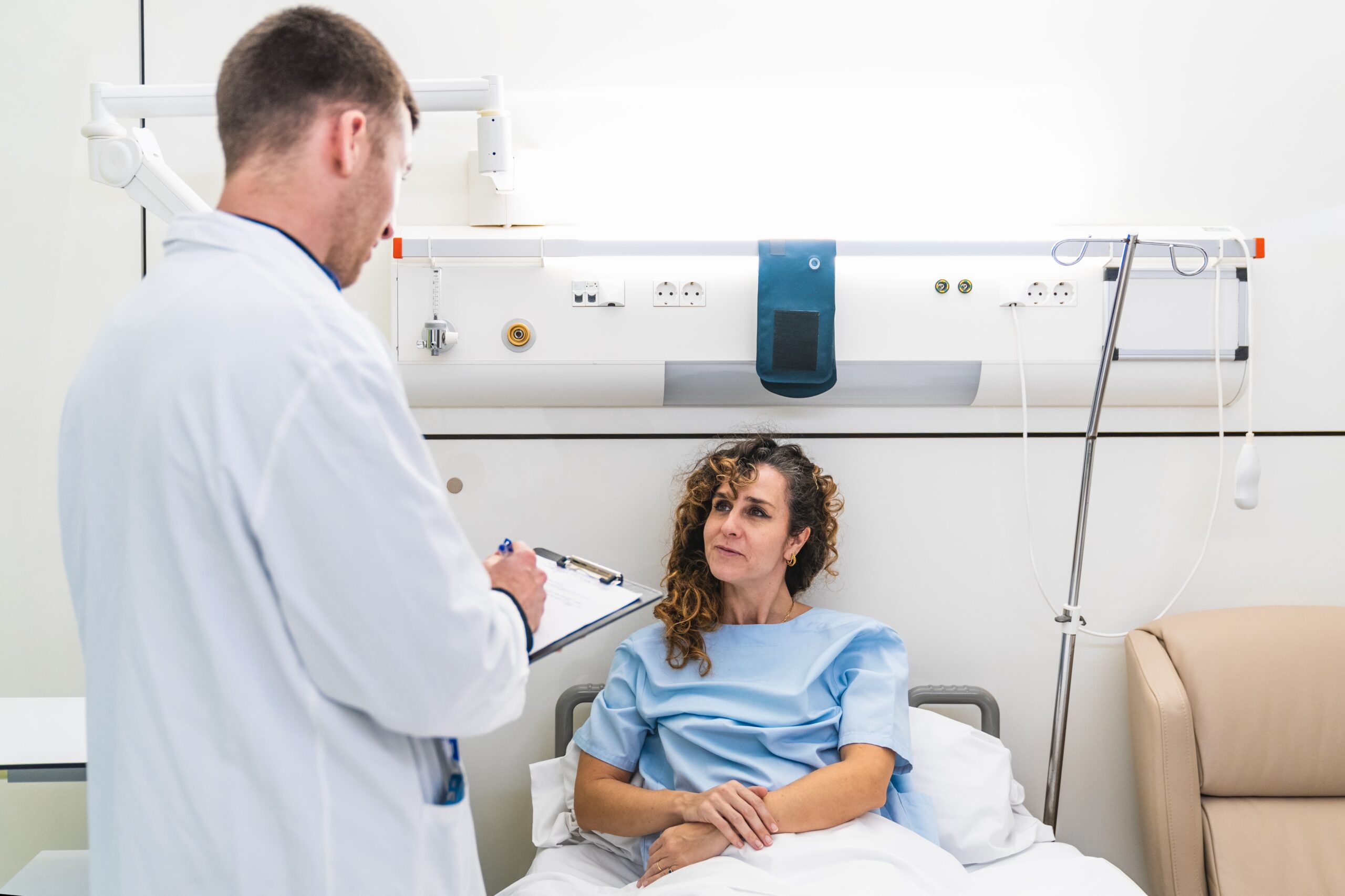 compassionate doctor discussing long-term health effects of drug addiction