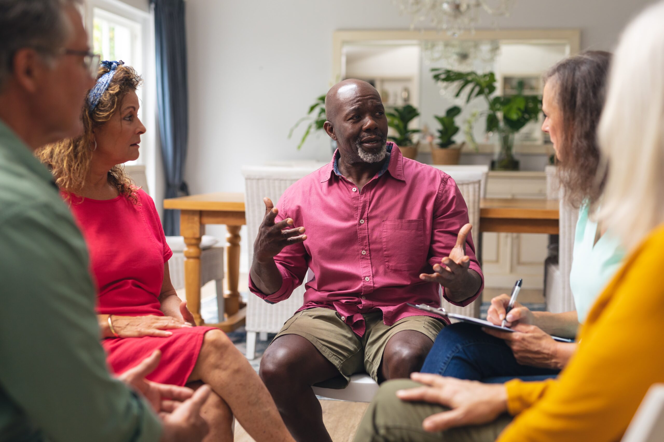 therapist guiding a gratitude-based session at a treatment center