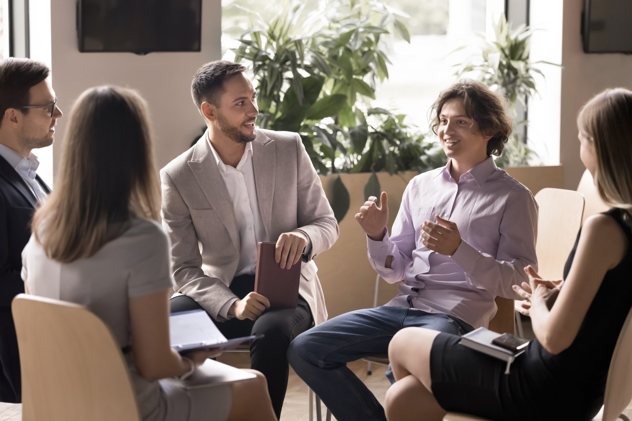 Group therapy session discussing whether to go through all 12 steps of recovery
