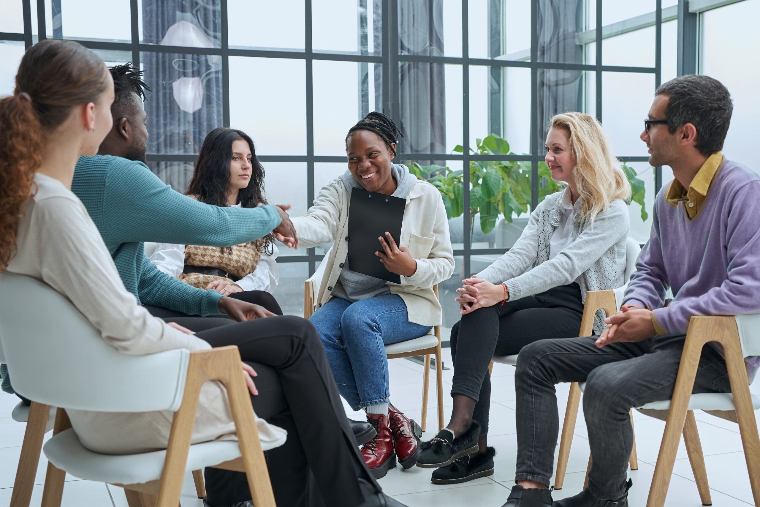 Support group discussing the 12 steps of recovery at Amazonite Treatment Centers