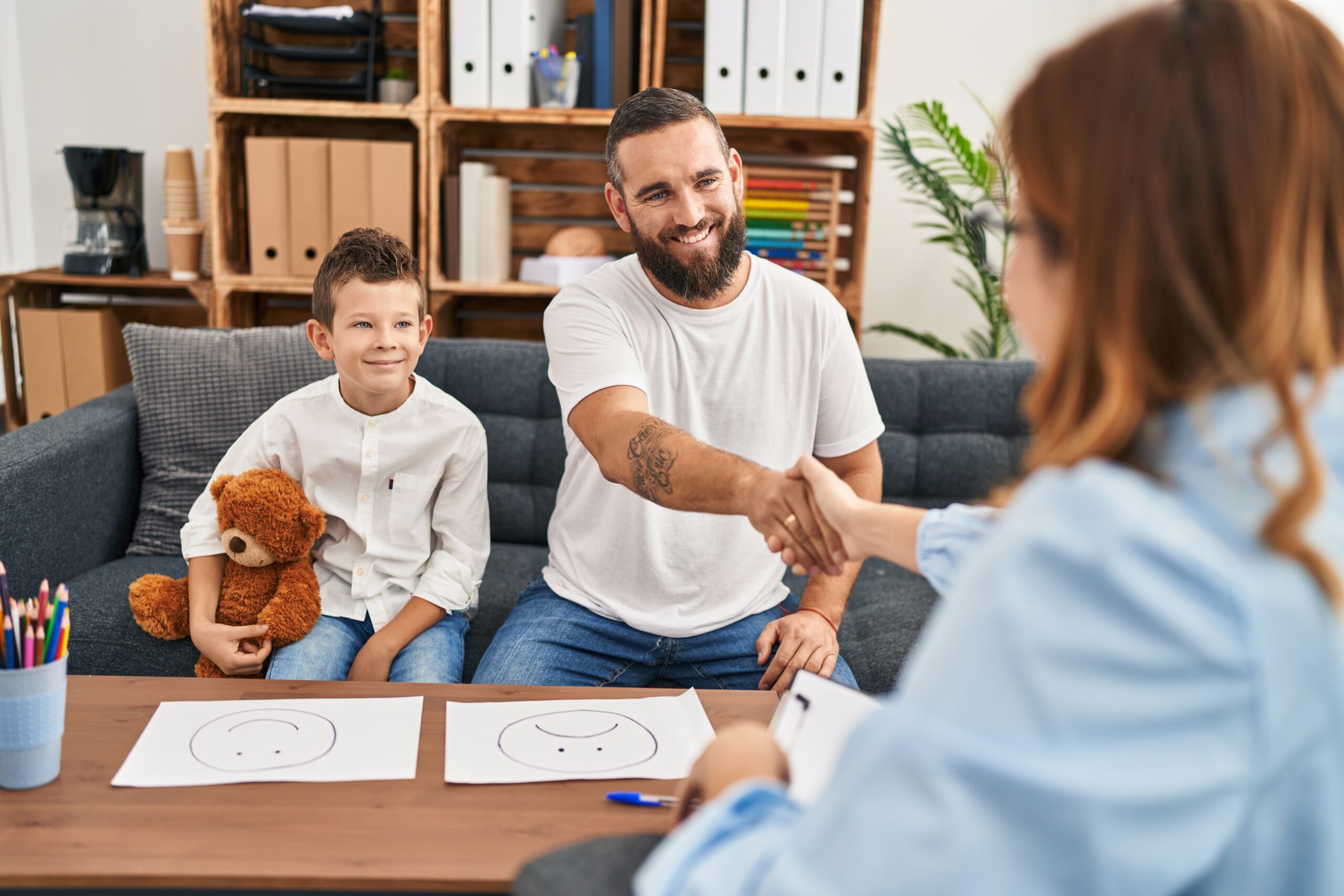 Family smiling together in a supportive recovery environment