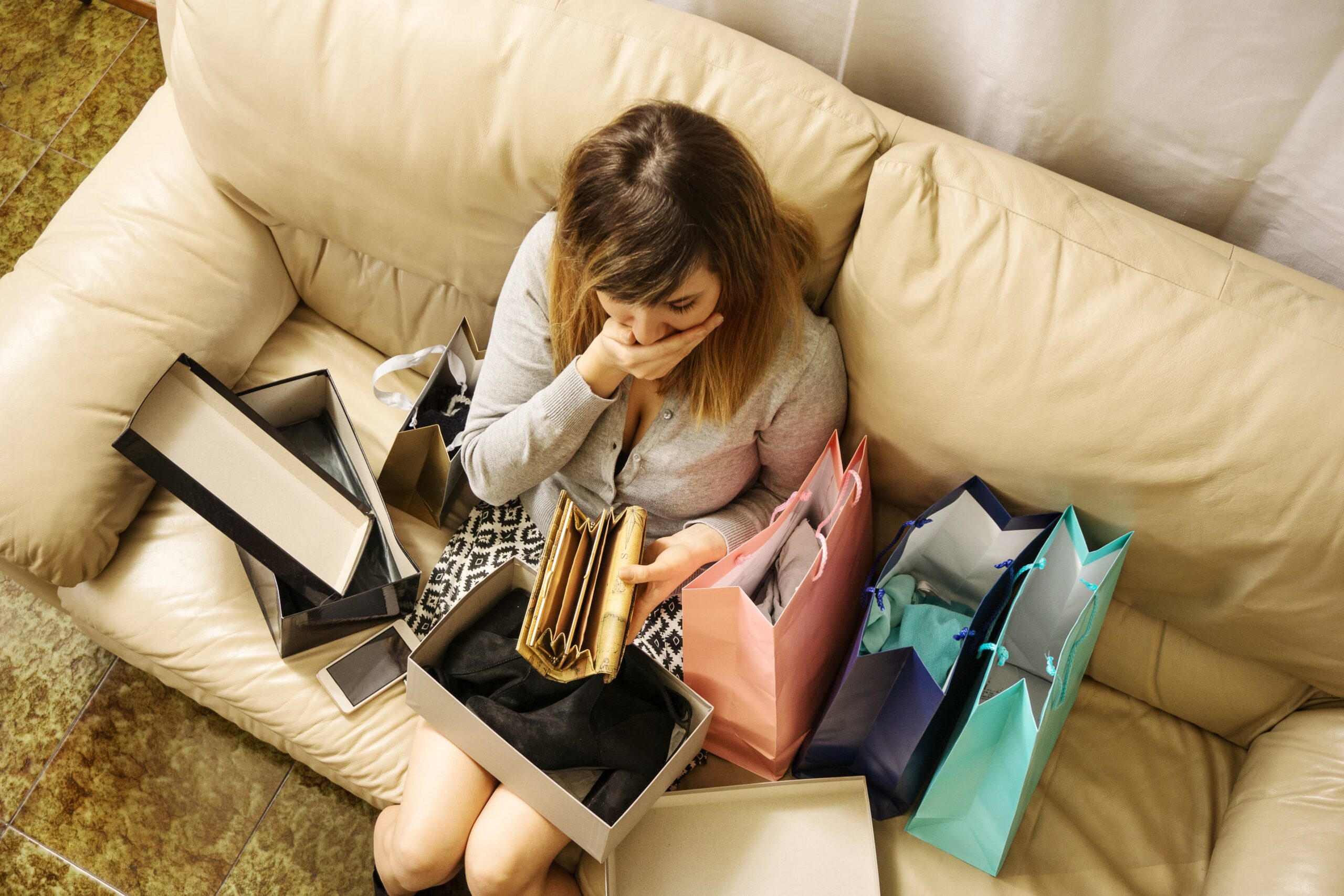 Person wondering “Am I addicted to shopping?” as compulsive buying takes a toll