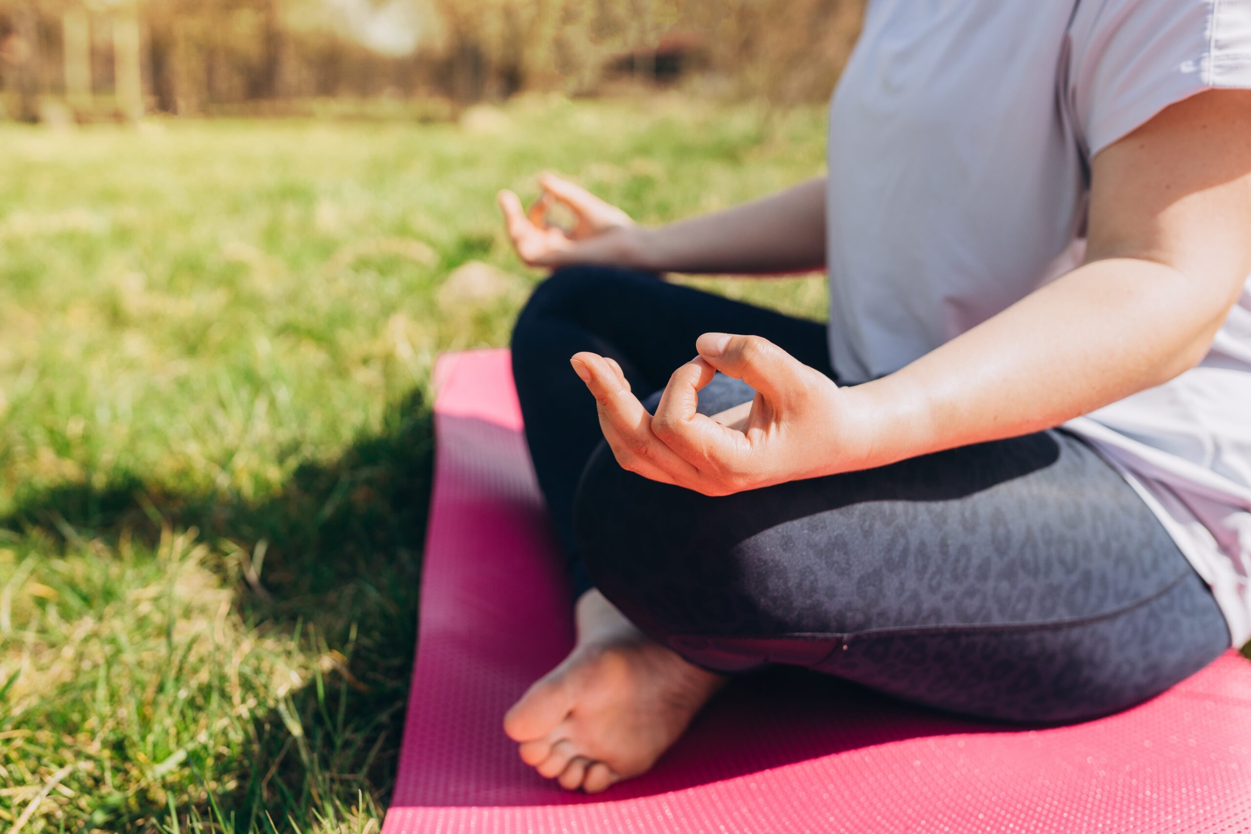 Individual using grounding techniques through deep breathing in recovery