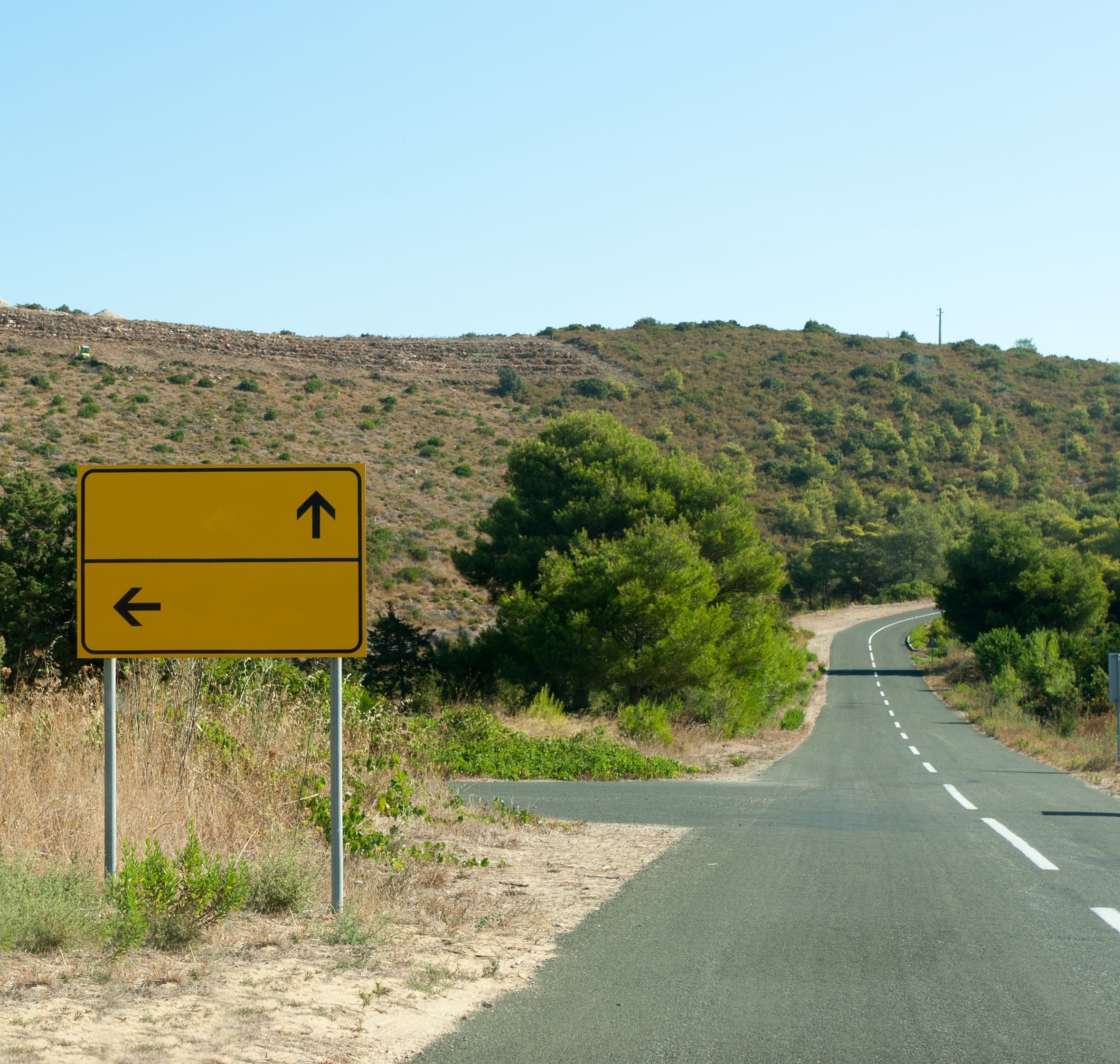 Road split (fork) sign on quiet street addictions start same way different paths