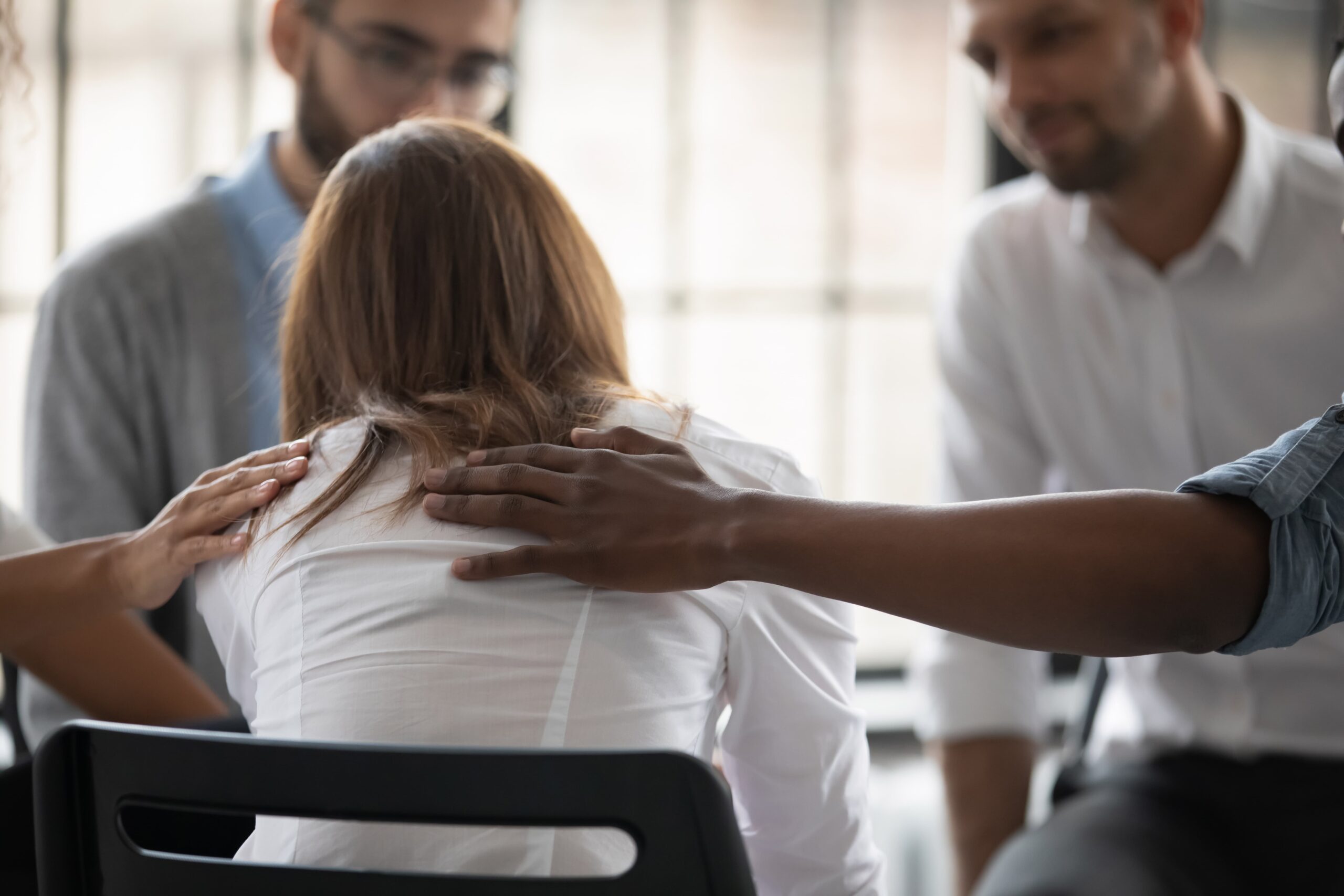 Therapist supporting a patient during addiction recovery session
